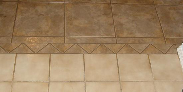tile transition, connect tile flooring, connect flooring, different flooring materials, brown tiles, triangular tiles, triangle tiles