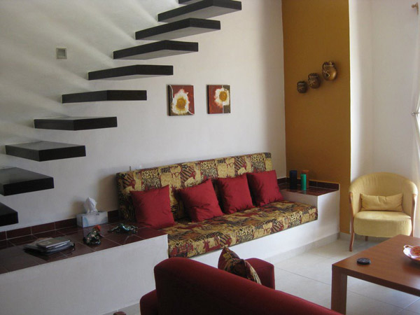 living-room-idea-under-black-wood-floating-stairs